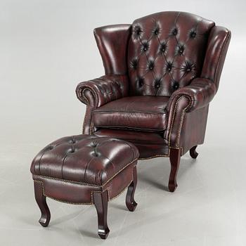ARMCHAIR with STOOL, Chesterfield model, "Möbel Art", 20th century later part.