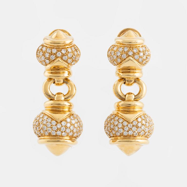 A pair of 18K gold earrings set with round brilliant-cut diamonds.