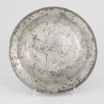 A large pewter charger, Sweden, dated 1701.