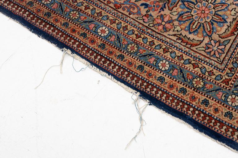 An oriental carpet, c. 425 x 305 cm.