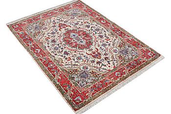 A Tabriz carpet, part silk, 50 raj, c. 204 x 154 cm.