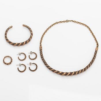 A set with a bronze necklace, bracelet, ring and two pairs of earrings. Kalevala koru, Helsinki.