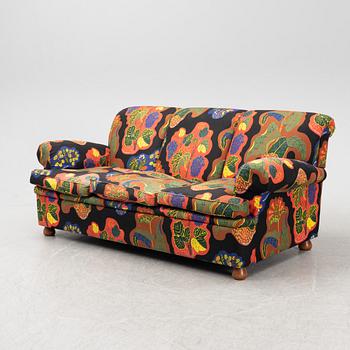 A model 703 sofa by Josef Frank for Firma Svenskt Tenn.