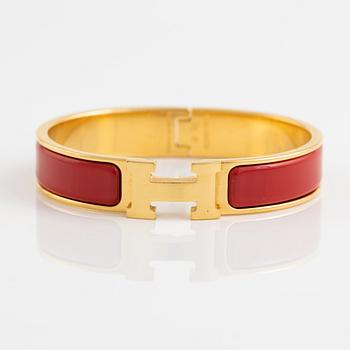 Hermès, a 'Clic H' bracelet.