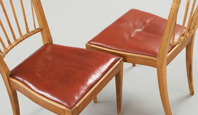 A pair of Josef Frank walnut and rattan chairs, Svenskt Tenn, model 1165.