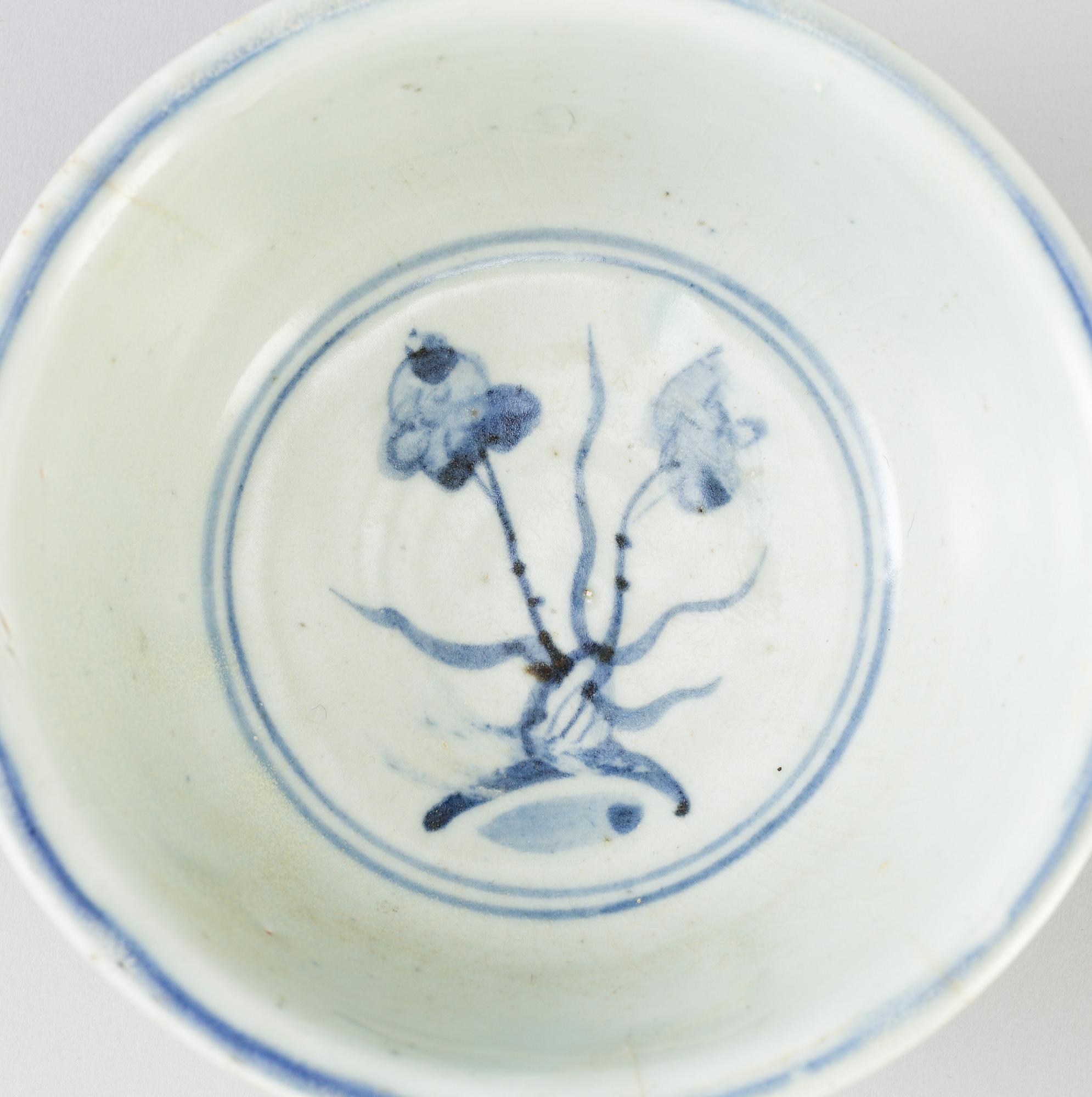 A blue and white Chinese porcelain bowl and two miniature jars for the South East Asian market, probably Ming dynasty.
