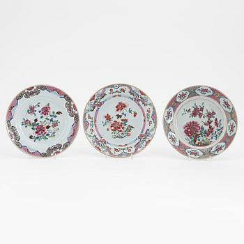 A group of nine Chinese famille rose porcelain plates, Qing dynasty, Yongzheng (1723-35) and Qianlong (1736-95).