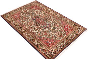 A Ghom rug, c. 202 x 137 cm.