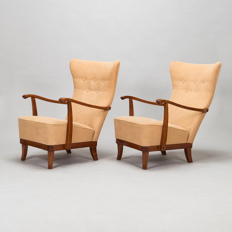 A pair of 1950s armchairs.