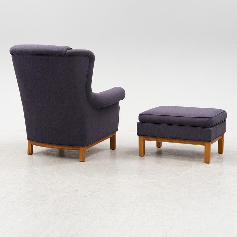 An armchair with foot stool, Norell Möbler AB, Sweden, late 20th century.