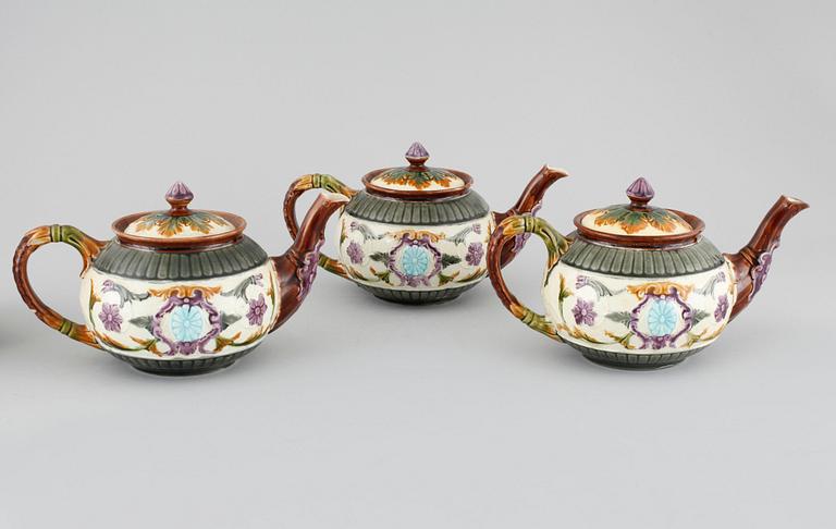 A majolica collection of one coffee pot and three tea pots from Rörstrand, around turn of the century 1900.