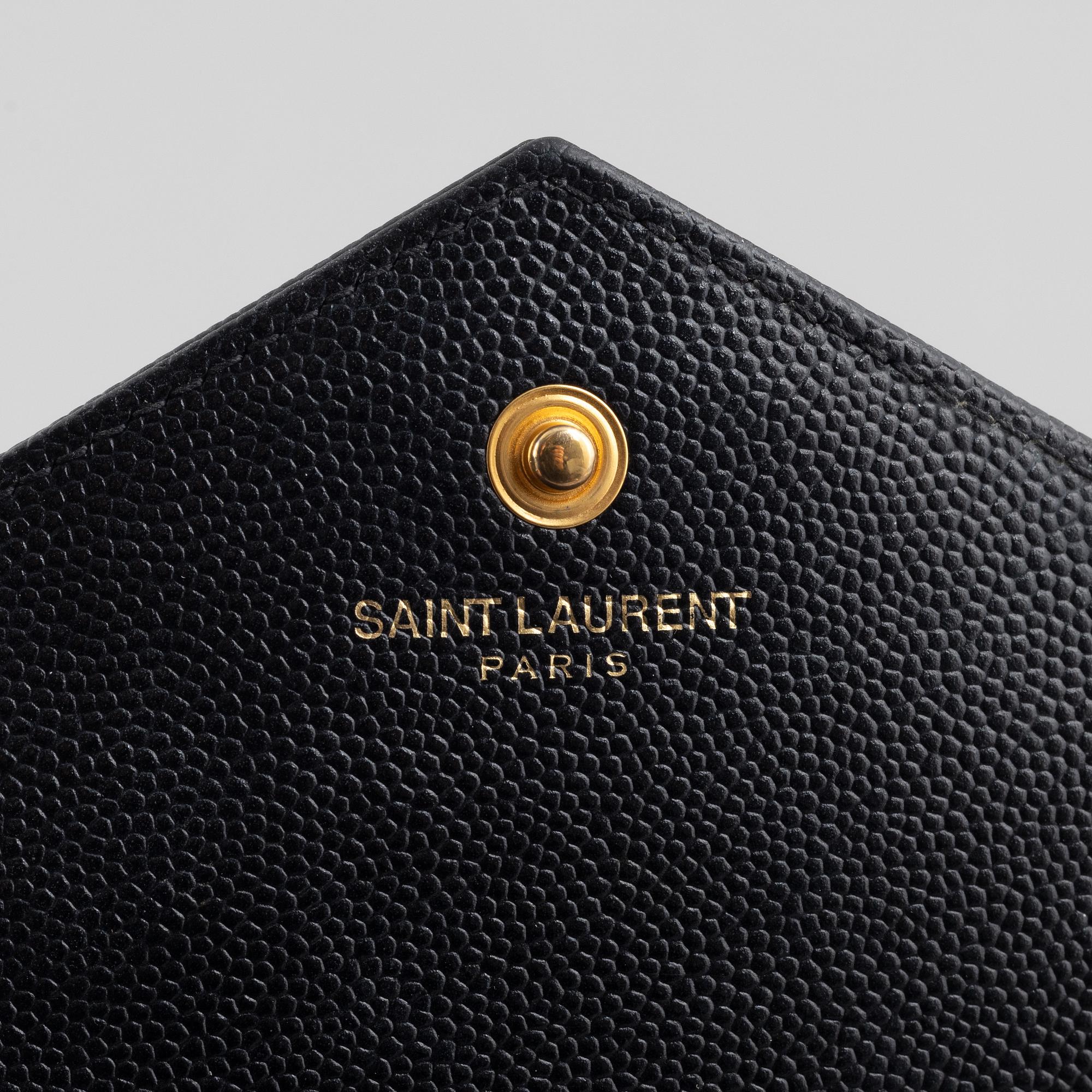 Yves Saint Laurent, a handbag/clutch.