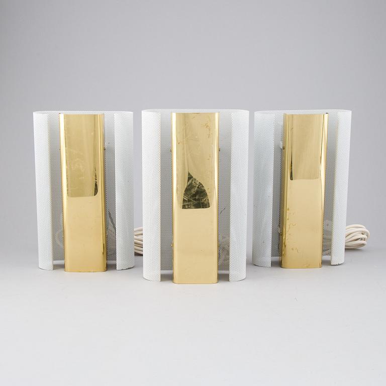 Hans-Agne Jakobsson, a set of three of 'V-451/18L'/'Rasputin' brass wall lights from Markaryd.