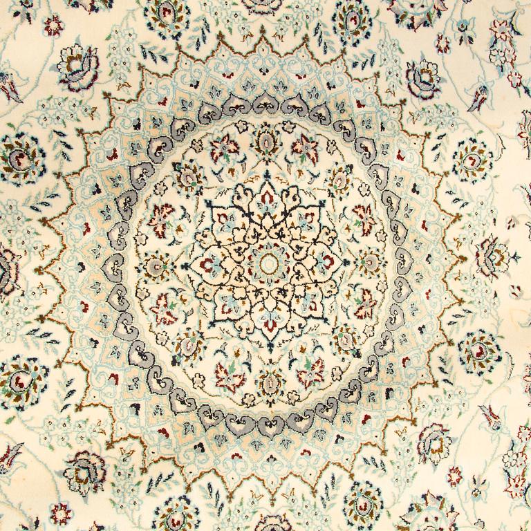 A carpet, Nain, part silk s.k 9LAA. Circa 376 x 249 cm.