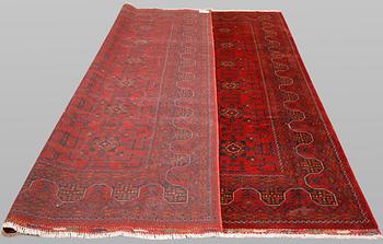 An Afghan rug, c. 298 x 251 cm.