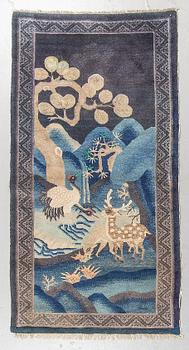 A rug, semi-antique Baotou figural, China, ca 174 x 93 cm.