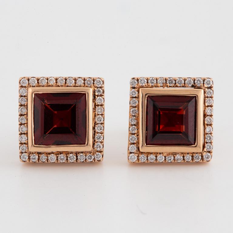 18K gold earrings with step-cut garnets and brilliant-cut diamonds.