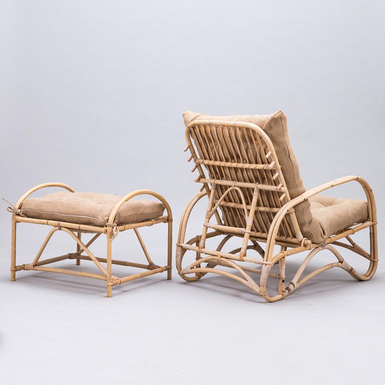 A rattan easy chair with stool, latter half of the 20th century.