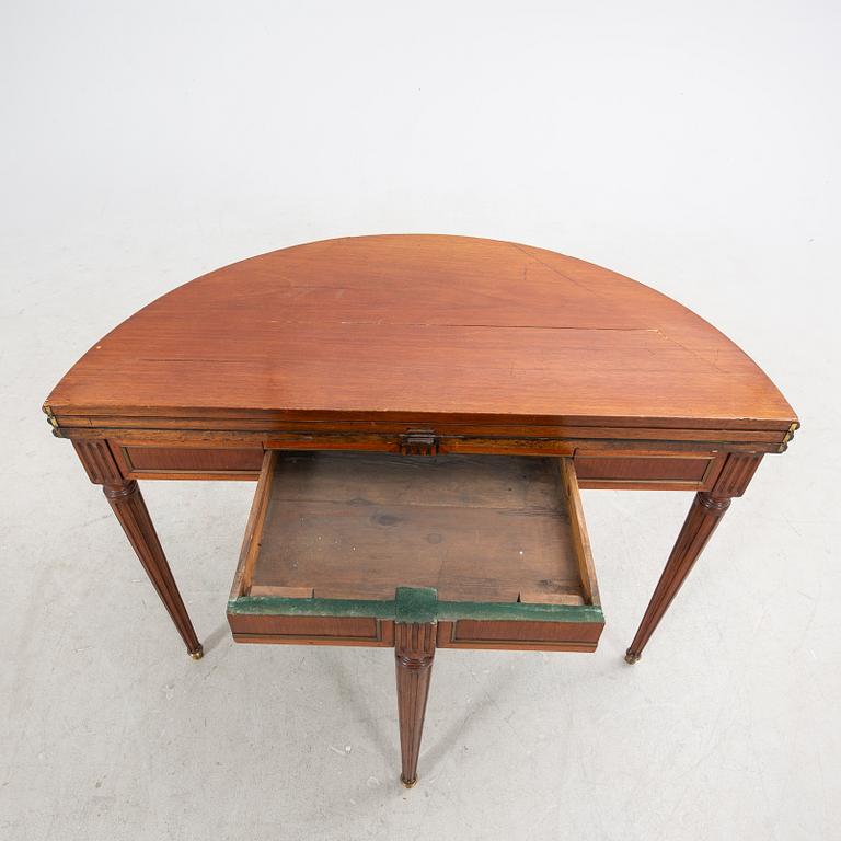 An erarly 1800s mahogany game table.