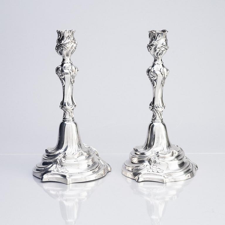 A pair of Swedish Rococo silver candlesticks, marks of Abraham Lundberg, Stockholm 1765.