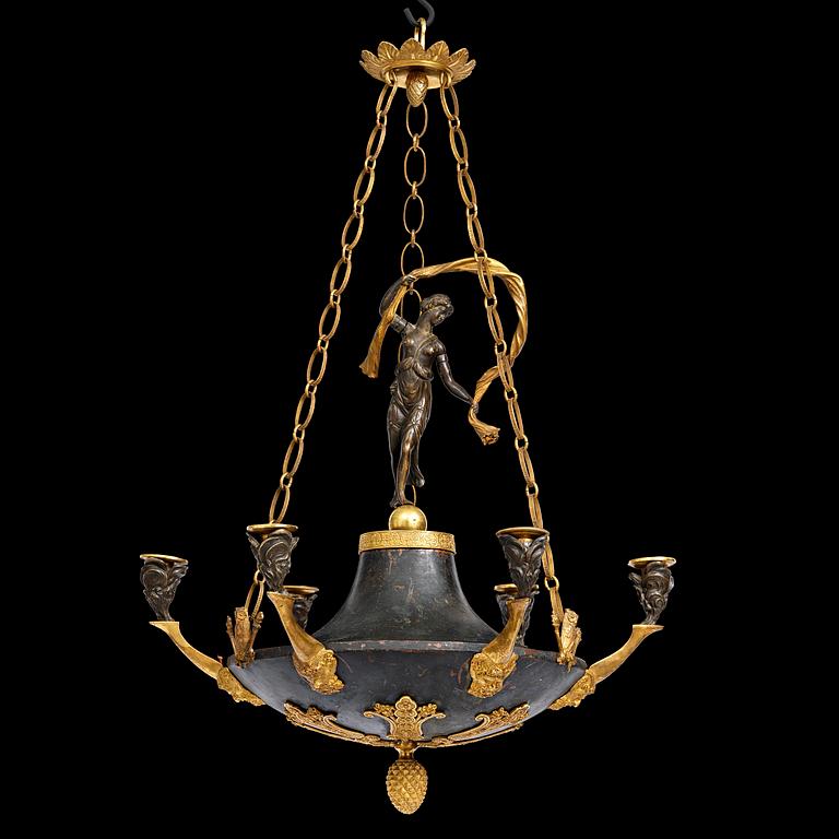 A patinated and ormolu six-light Empire chandelier, Stockholm, first part 19th century.