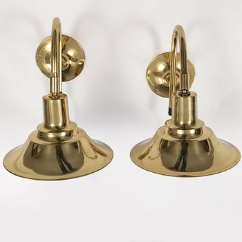 A pair of brass wall lamps by Börje Claes, late 20th century.