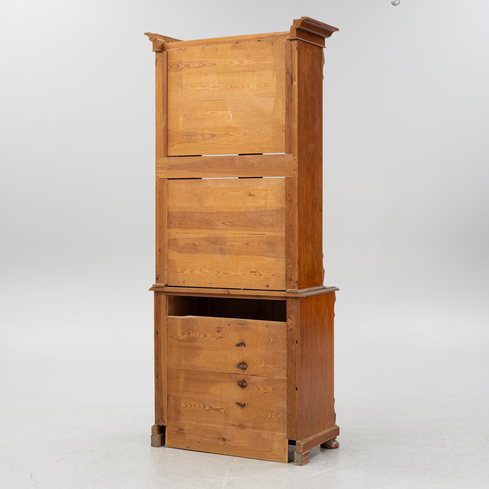 A pine cabinet, later part of the 19th Century.