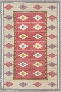 A sewdish flat weave carpet by Anna Greta Sjöquist, sigend AGS. Around 225 x 149 cm.