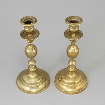 A PAIR OF BRONZE CANDLESTICKS, early 19th century.