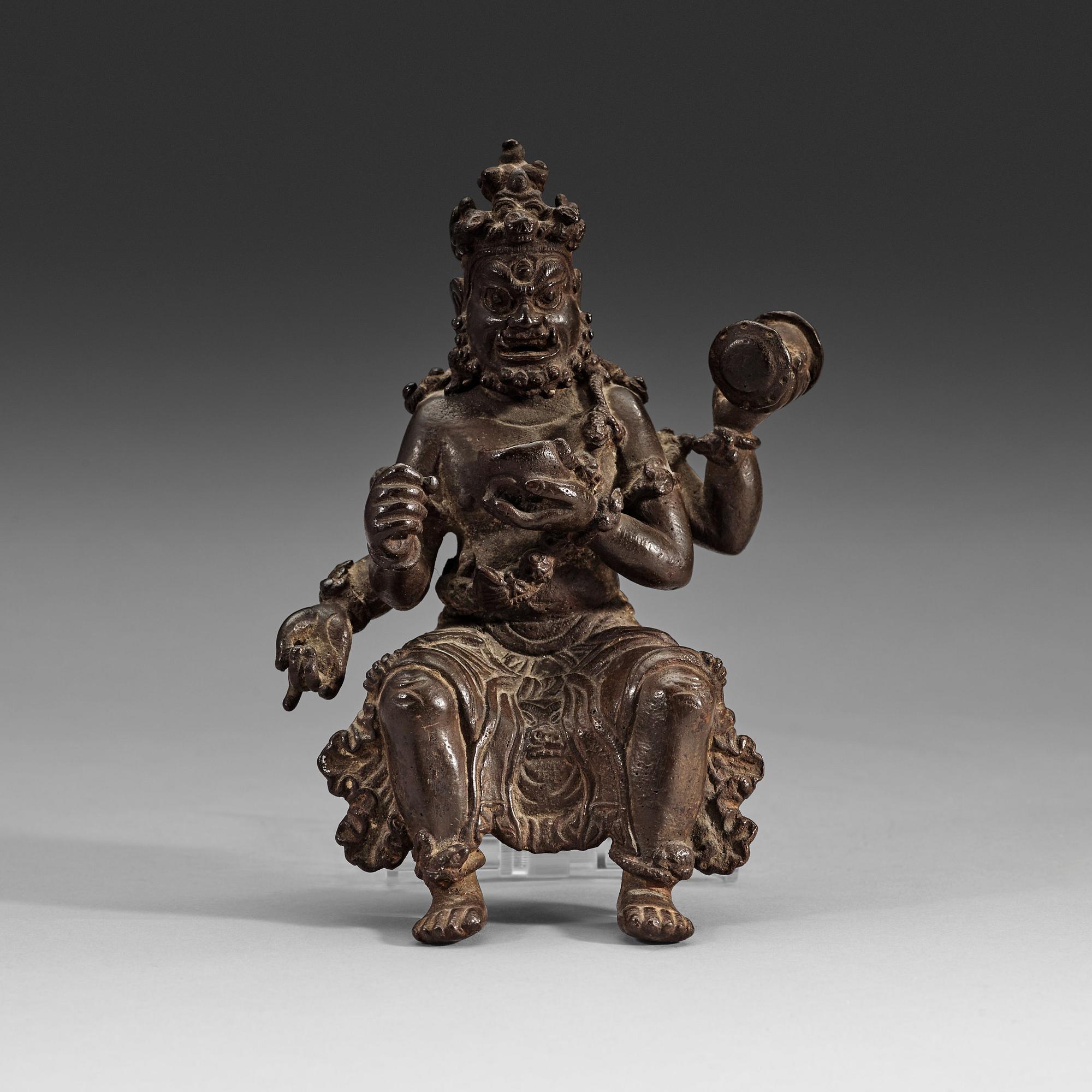 A seated bronze figurine of Mahakala, 15/16th Century or earlier.