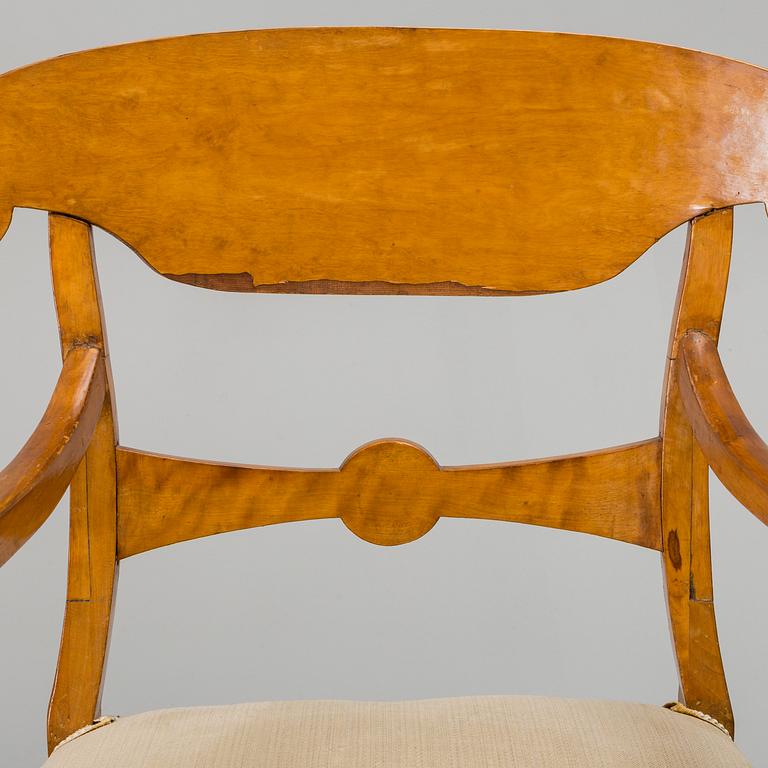 A set of four mid 19th century arm chairs.