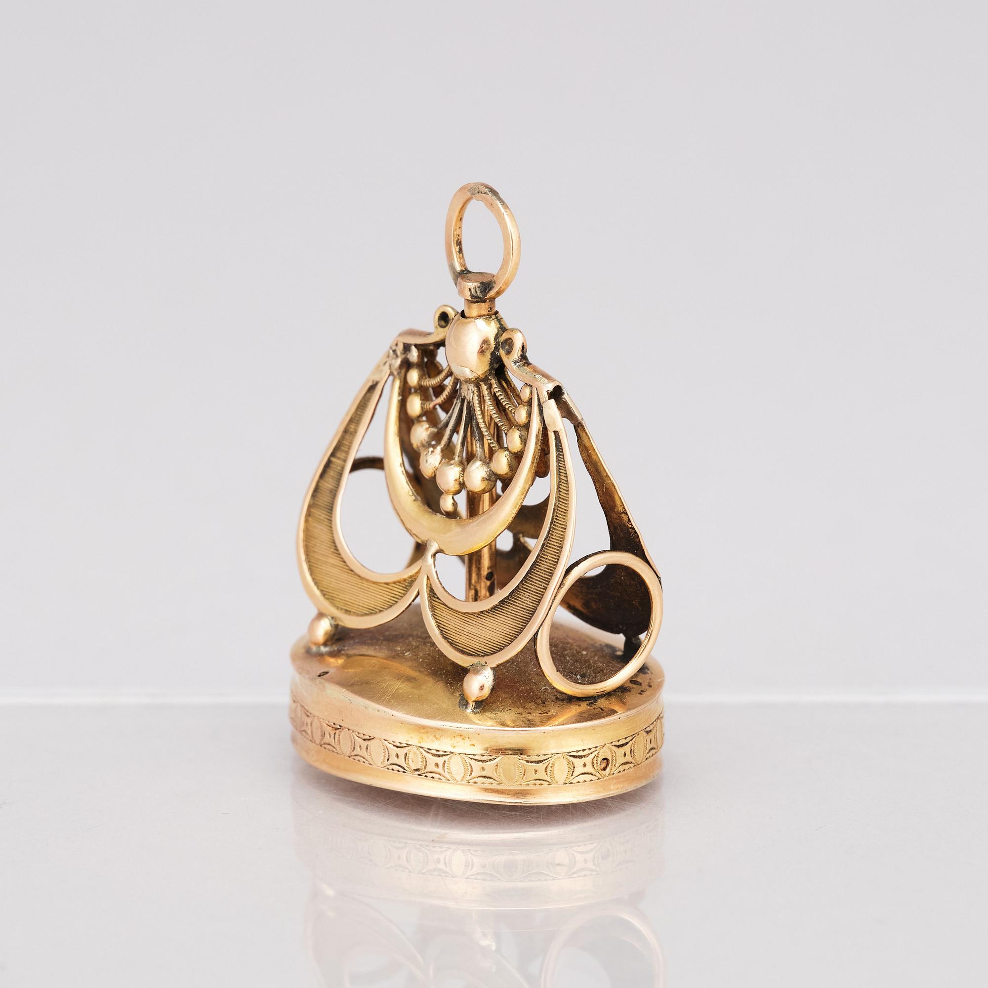 A gold musical fob seal. 19th Century.