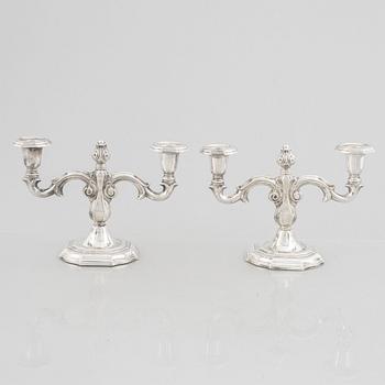 A pair of Swedish silver candelabras, marks of CG Hallberg, Stockholm 1959.