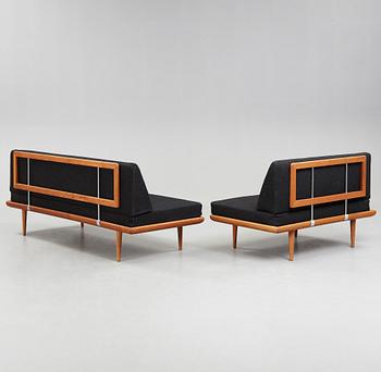 A set of two Danish 'Minerva' sofas with a table for France & Daverkosen.