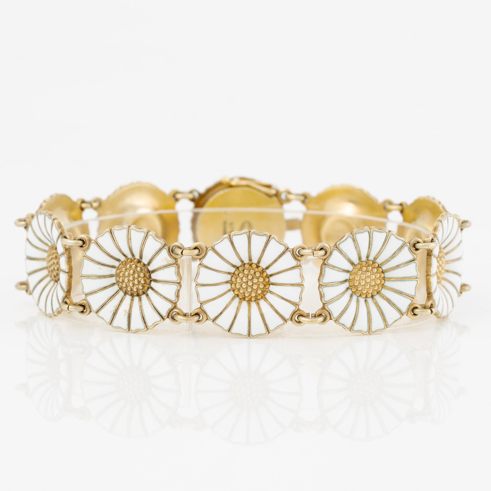 Georg Jensen and A Michelsen "Daisy" a bracelet, a pendant, and a brooch silver gilt and enamel.
