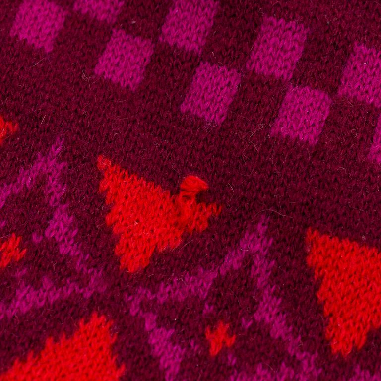 Louis Vuitton, a knitted cashmere hat and scarf.