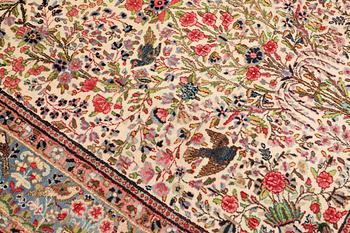 A semi-antique Kirman Laver carpet, 'Millefleur', c. 314 x 210 cm.