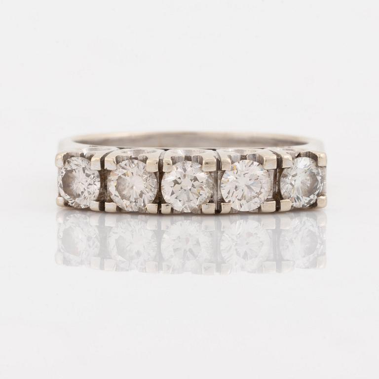 A 14K gold ring set with round brilliant-cut diamonds.