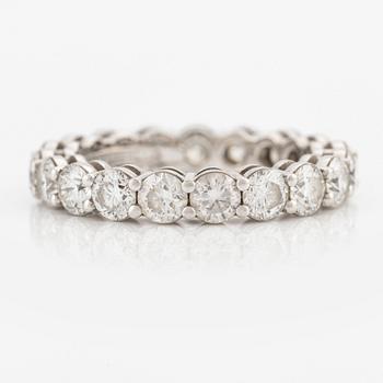 A platinum Tiffany & Co eternity ring set with round brilliant-cut diamonds.