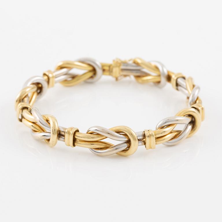 A bracelet in 18K gold and white gold.