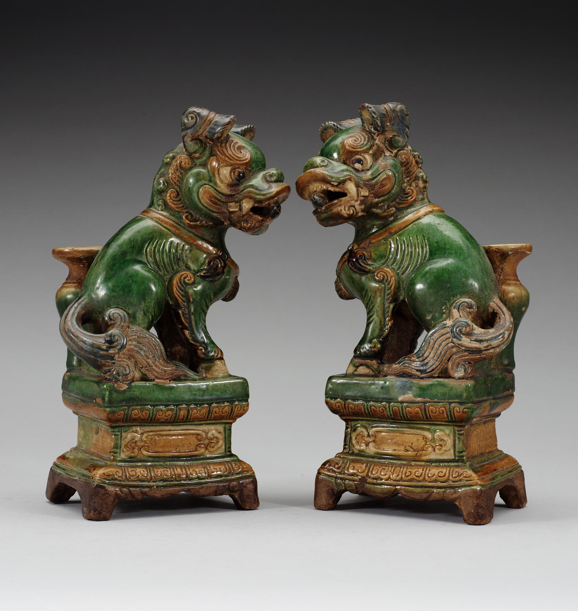 A pair of seated Buddhist lions, 17th Century.