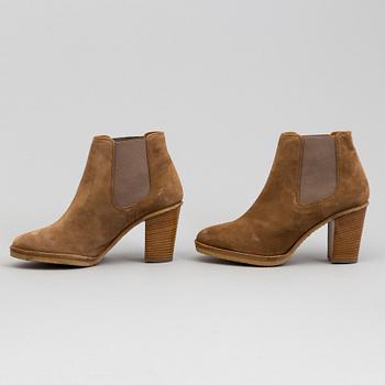 A pair of suede bootie byRalph Lauren.