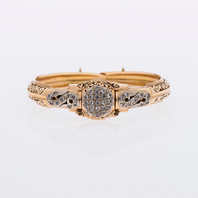 ARMBAND / ARMBANDSUR, 18K guld, åttkantslipade diamanter.