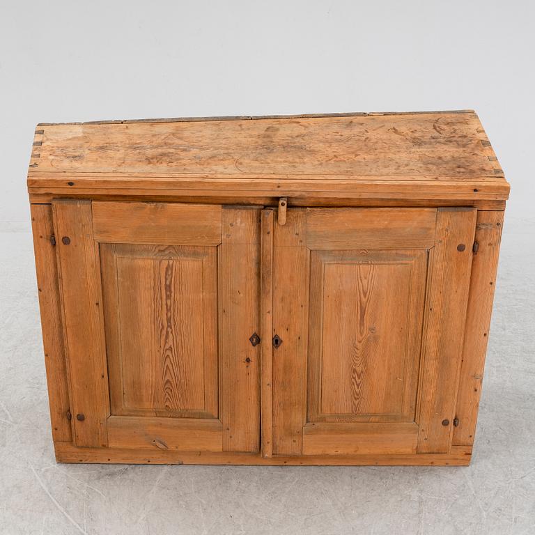 A 19th Century pine cabinet.