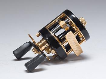 FISKERULLE och GLAS, ett par, Abu Garcia och Mats Jonasson, Målerås glasbruk.