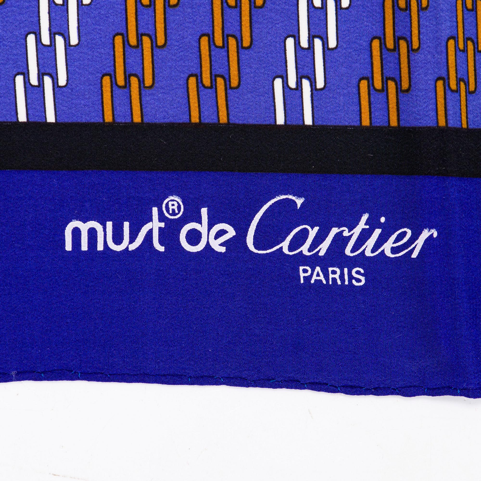 must de Cartier, a silk scarf.