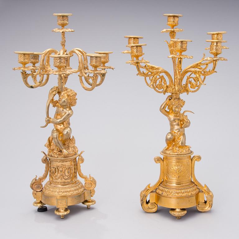 Two similar mid 19th century candelabra in gilt bronze,