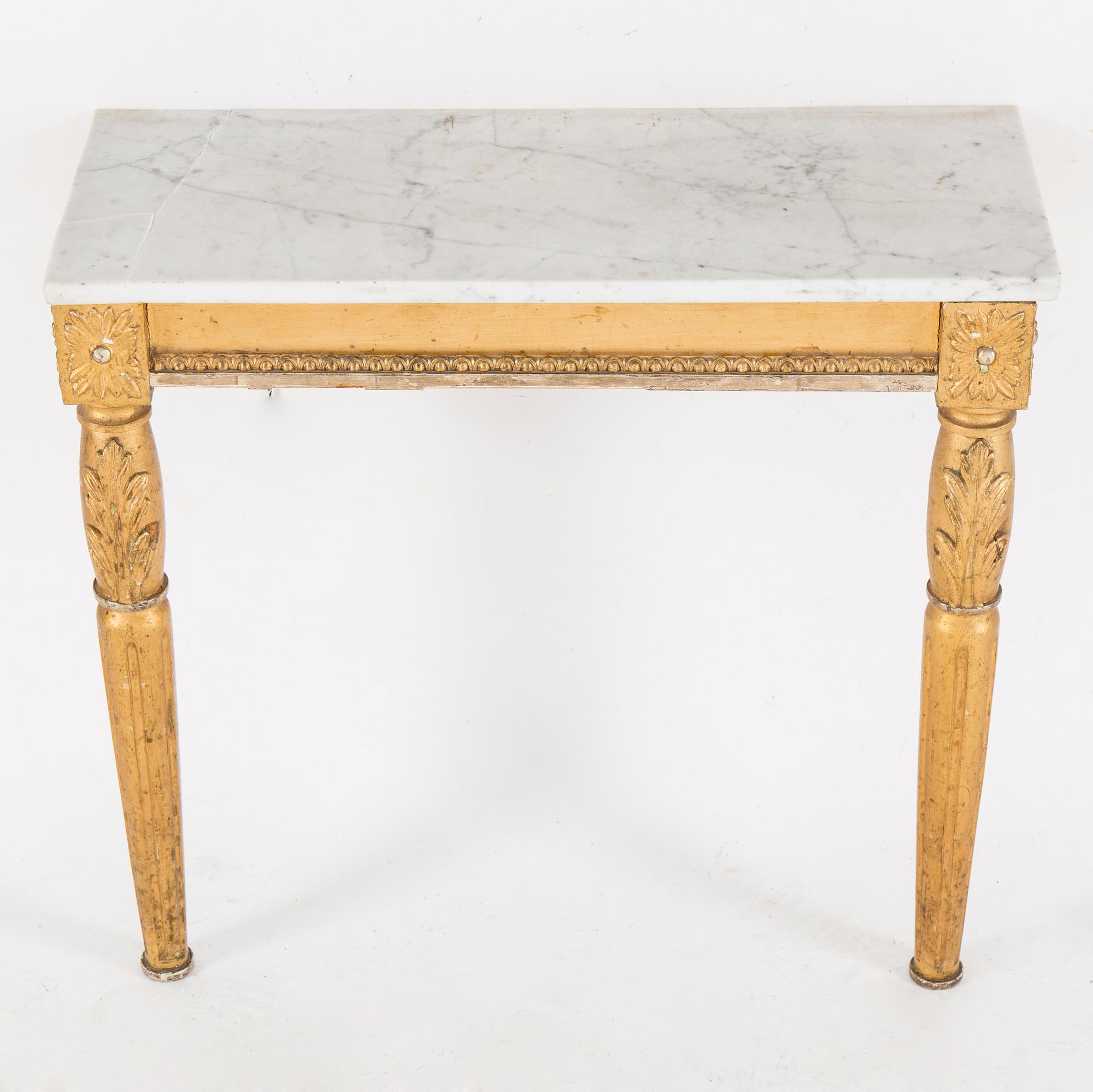 A Swedish Gustavian style mirror and console table with marble top from the first half of the 20th century.