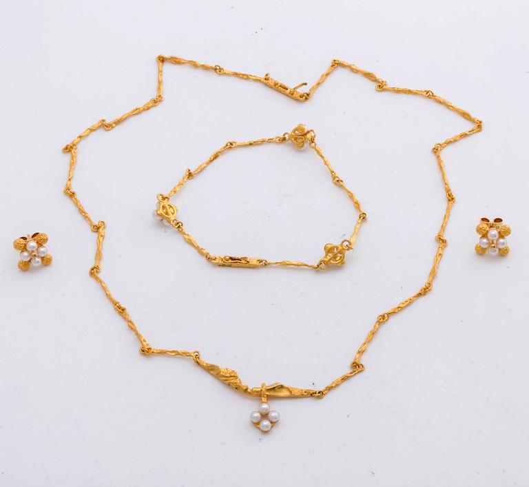 LAPPONIA, parure, 18K gold and cultured pearls approx 3 mm, design Björn Weckström 1999, certificate and original box.