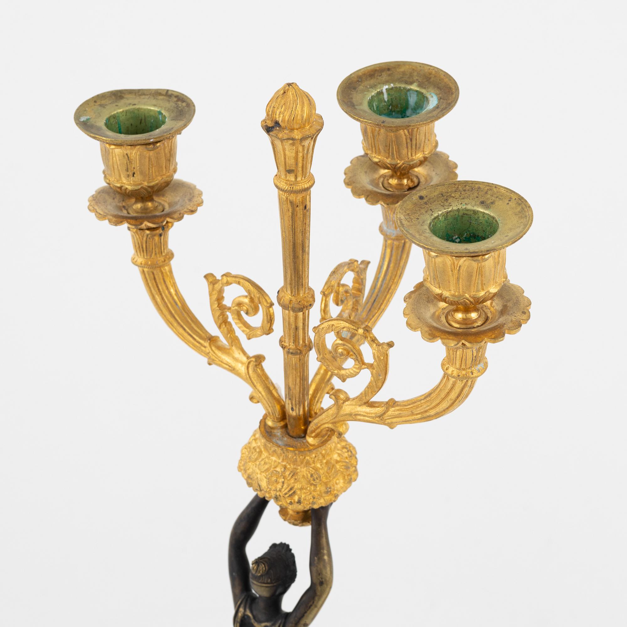 A pair of bronz empire style candelabras, 19th Century.